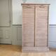 Antique furniture with double curtains sanded to white