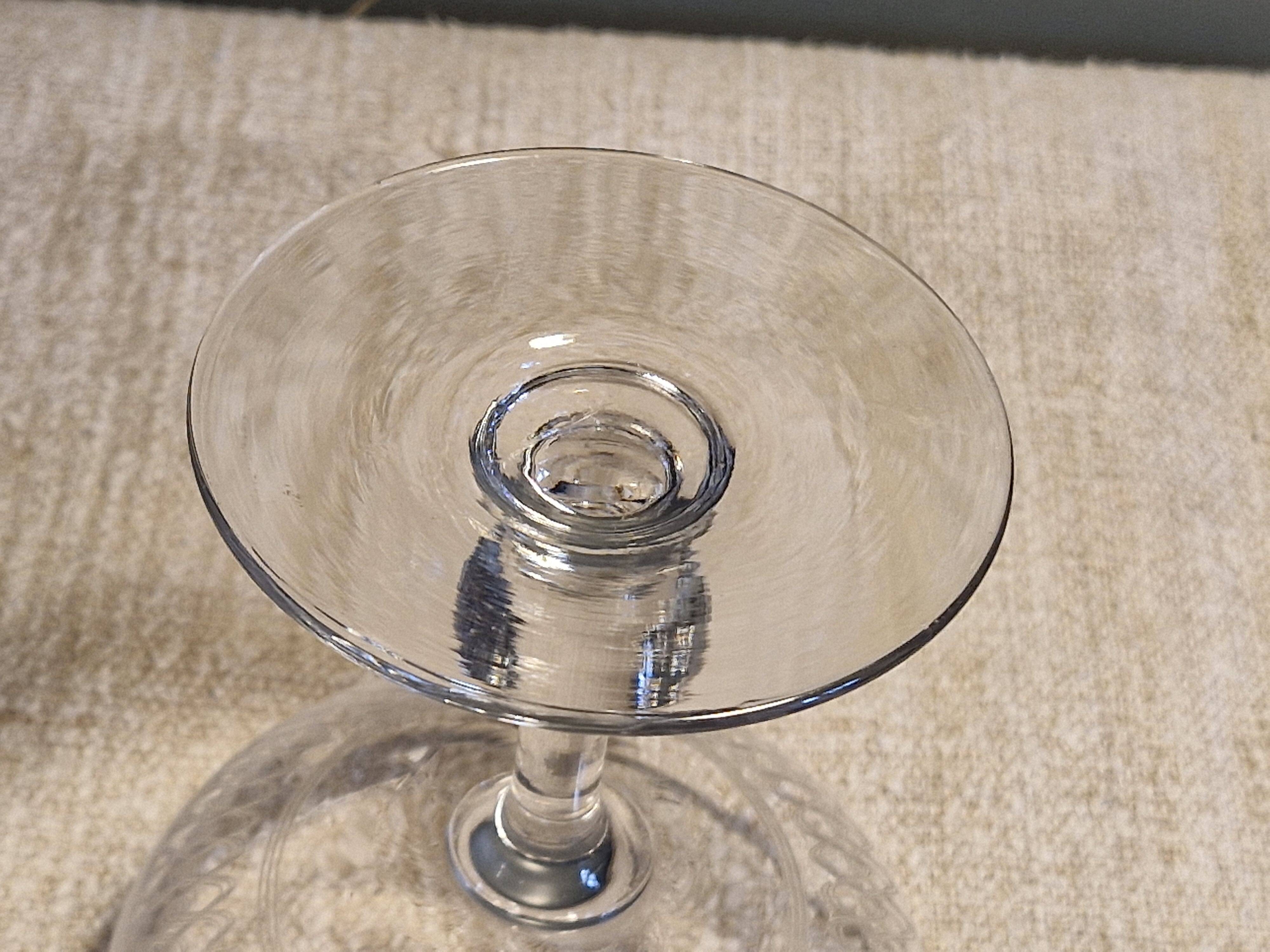 8 antique Baccarat crystal champagne coupes with engraved decoration.