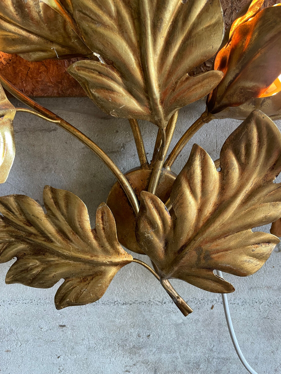 Golden wall lamp foliage
