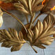 Golden wall lamp foliage