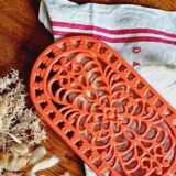 Orange enamelled cast iron oval trivet