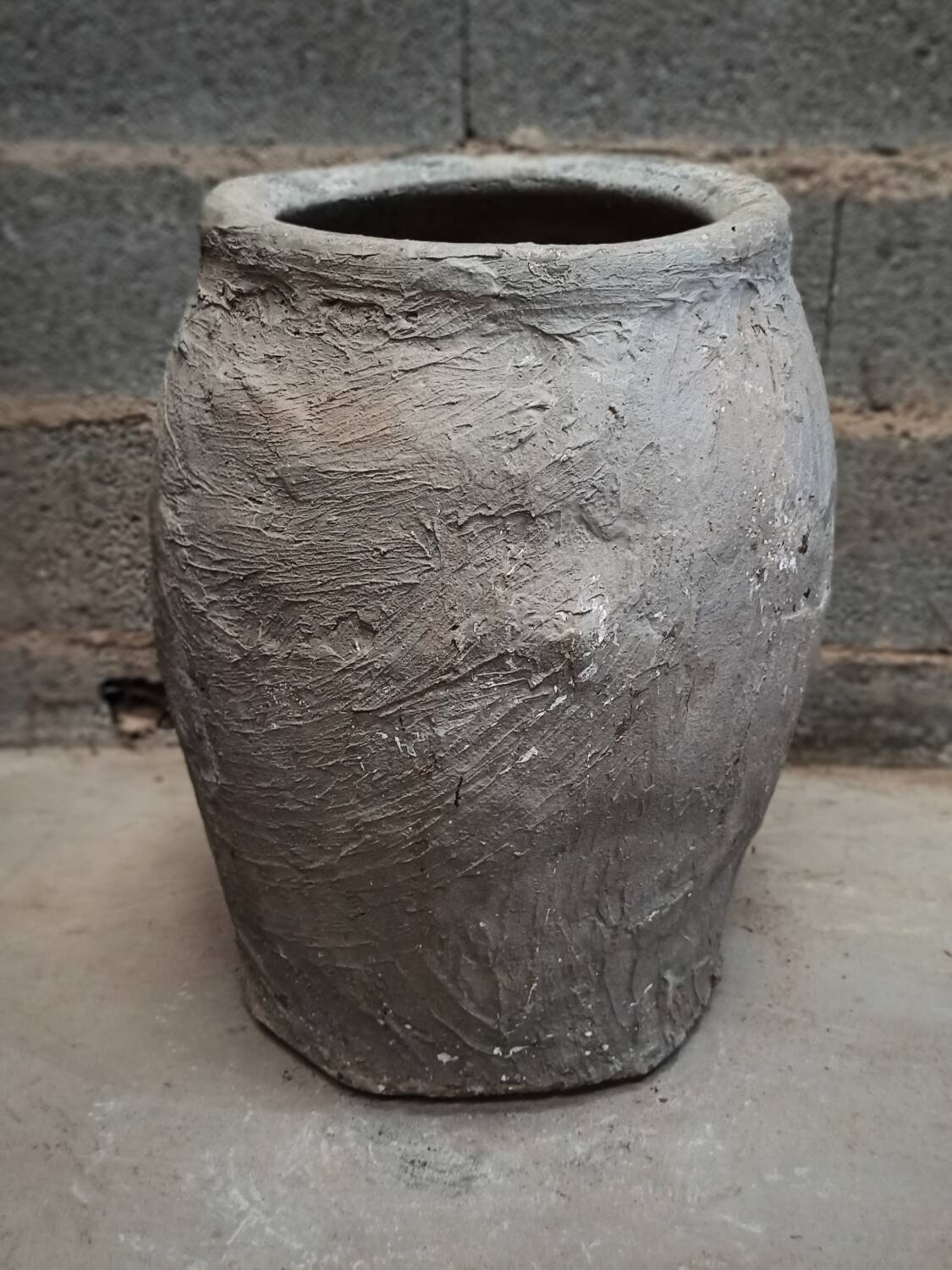 Old gray terracotta pot