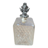 Vintage cut glass carafe with lion decorative stopper.