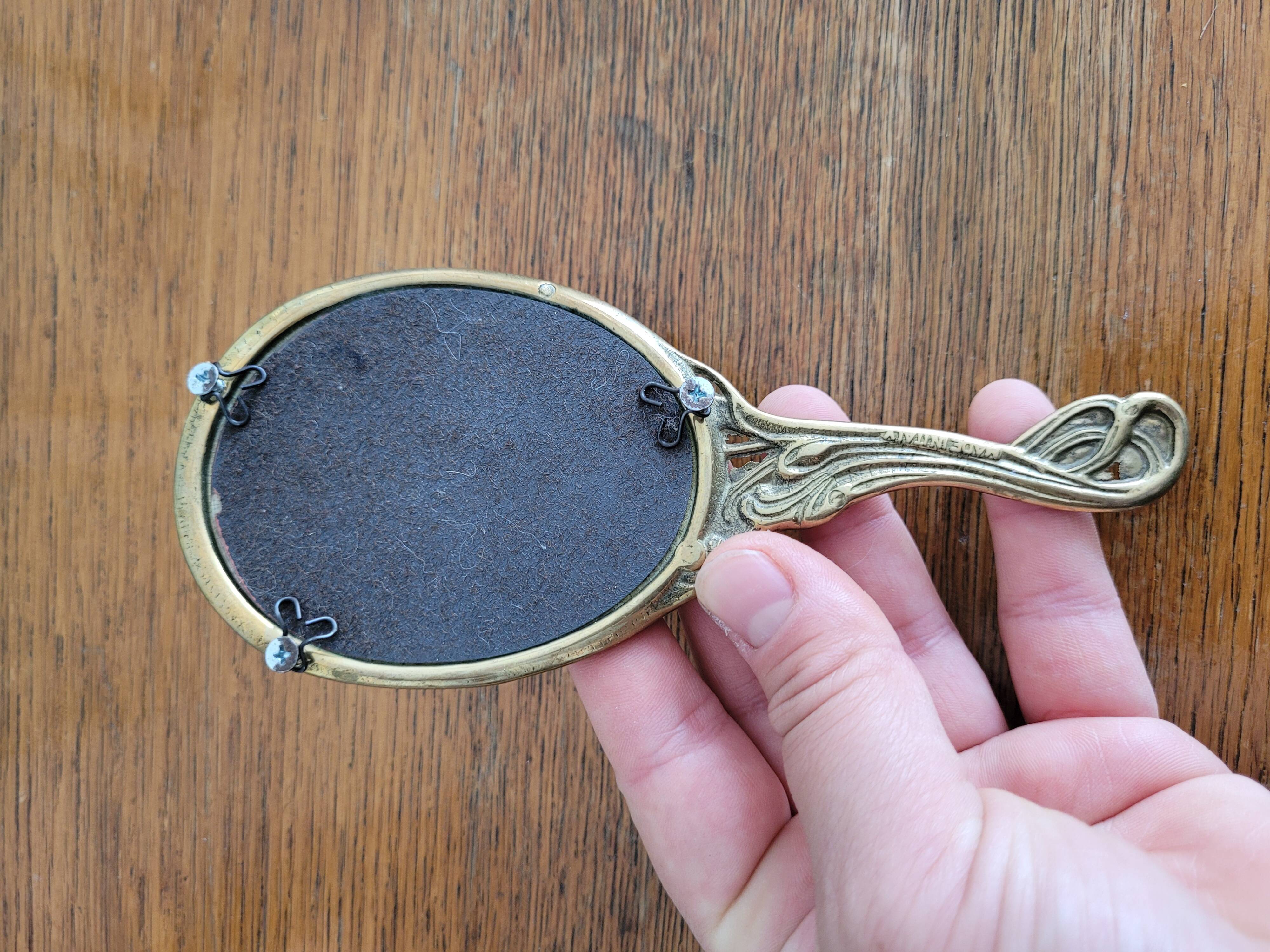 Art Nouveau brass hand mirror