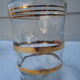 Golden liqueur service from the 1950s-1960s and its 12 glasses.