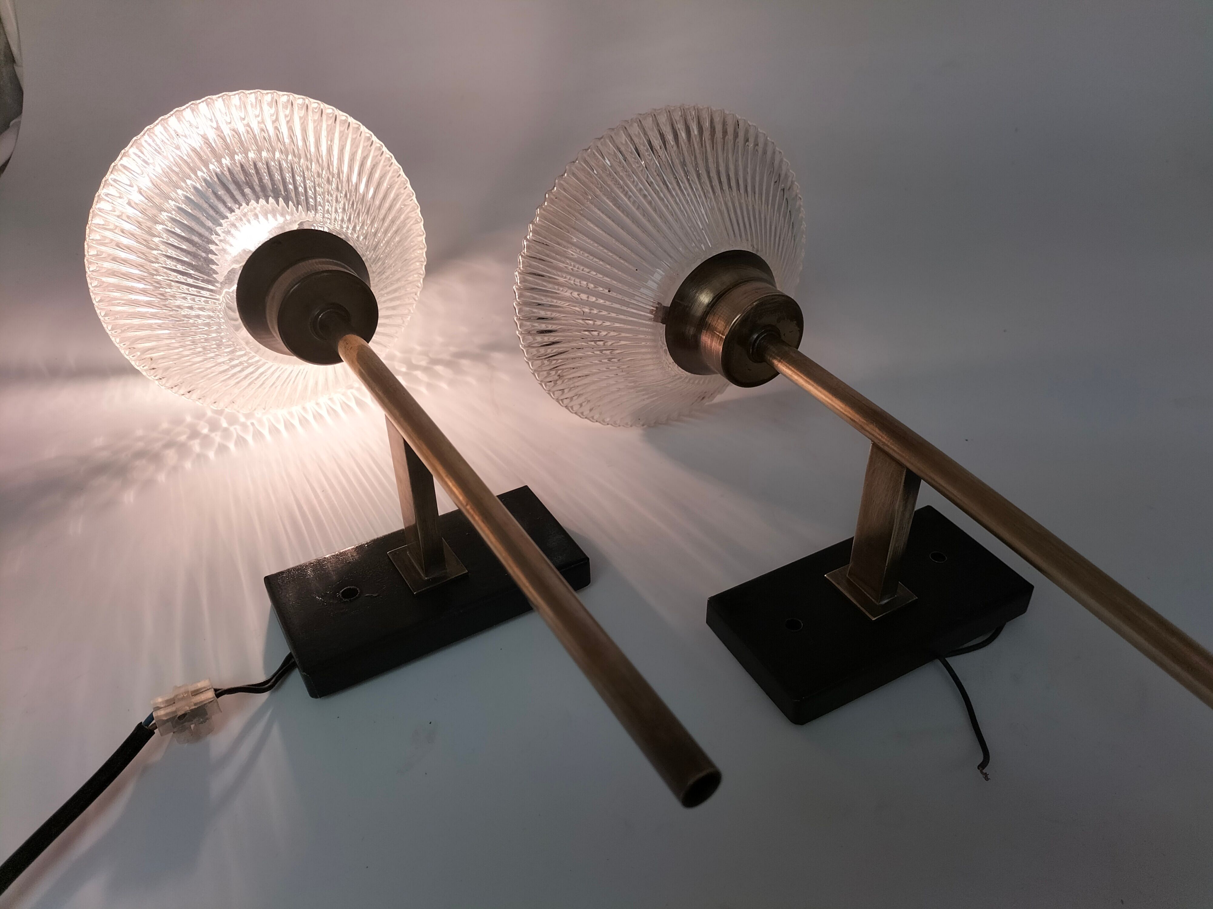 Pair of brass and glass wall lamps