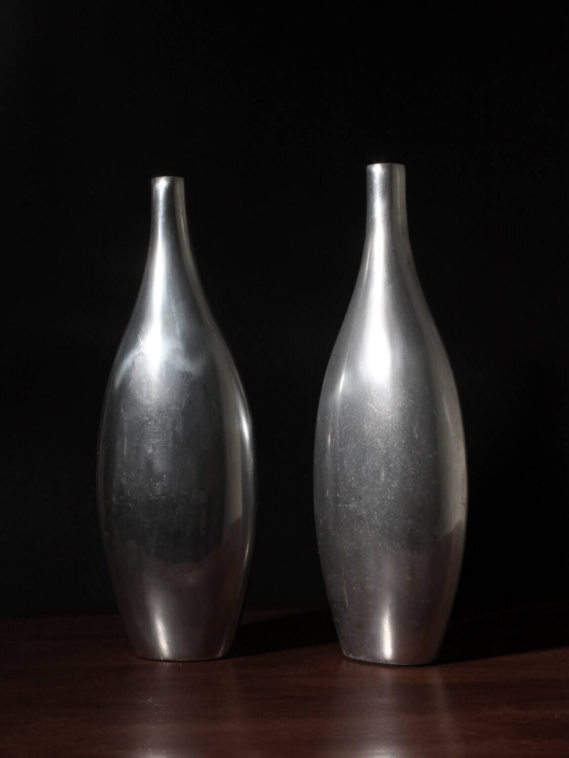 Pair Of Polished Aluminum Tall Vases