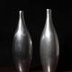 Pair Of Polished Aluminum Tall Vases