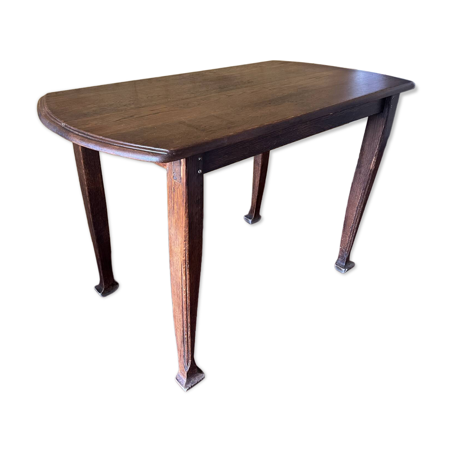 Vintage antique oak table with ornate legs.