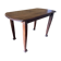 Vintage antique oak table with ornate legs.