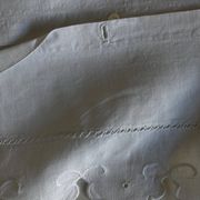 Pair of 19th-century linen pillowcases embroidered with scallops.