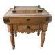 Genuine butcher's block made of solid wood with a knife drawer.