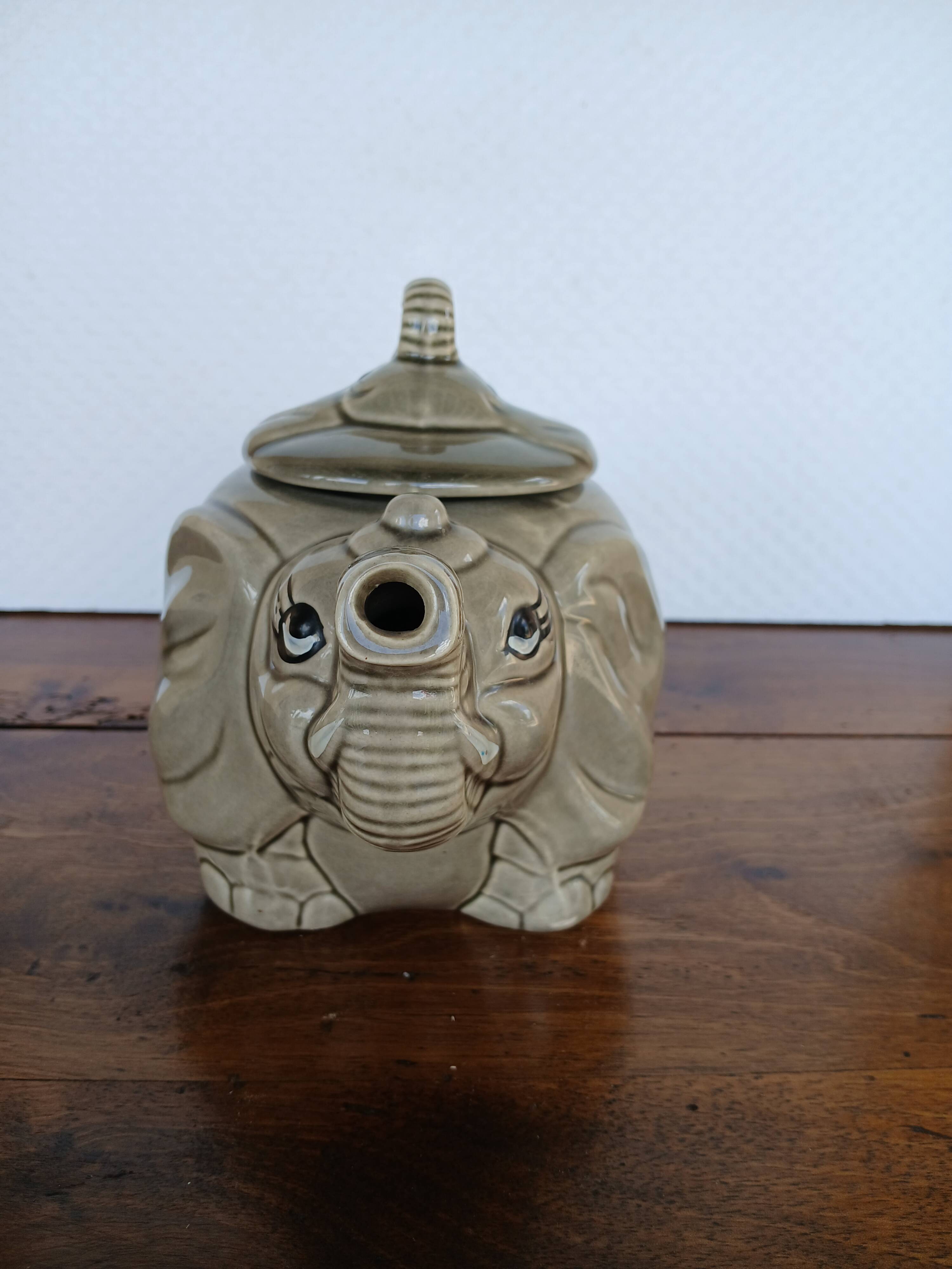 vintage ceramic teapot in the shape of a grey elephant