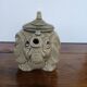 vintage ceramic teapot in the shape of a grey elephant