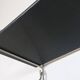 Mid-century vintage shelf in a loop shape, black glass and metal.