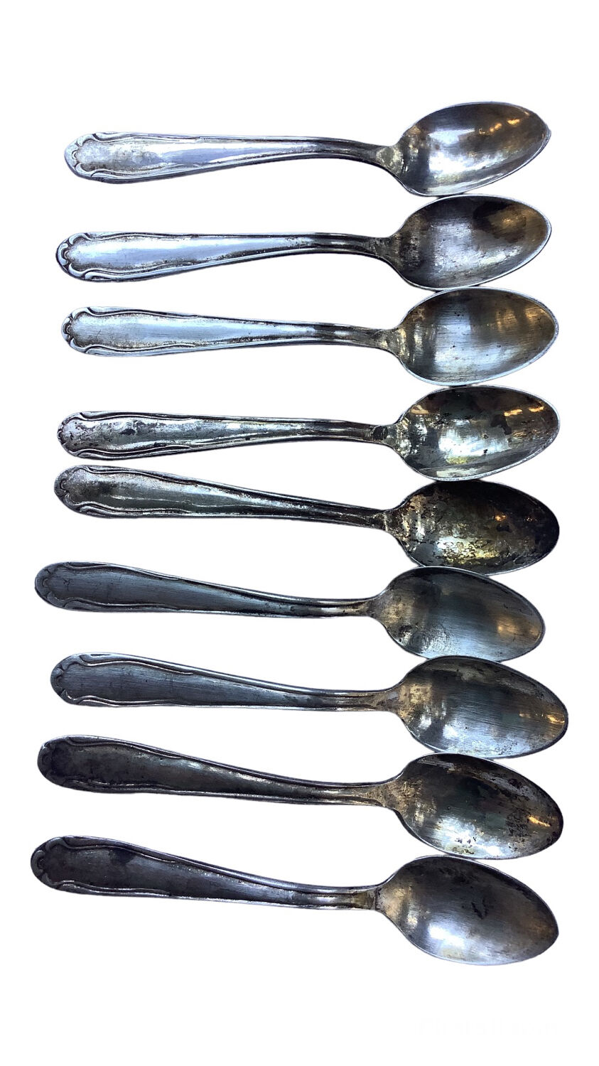 Nine small silver teaspoons