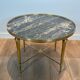 Round coffee table in brass with a marble top from the Ramsay house.