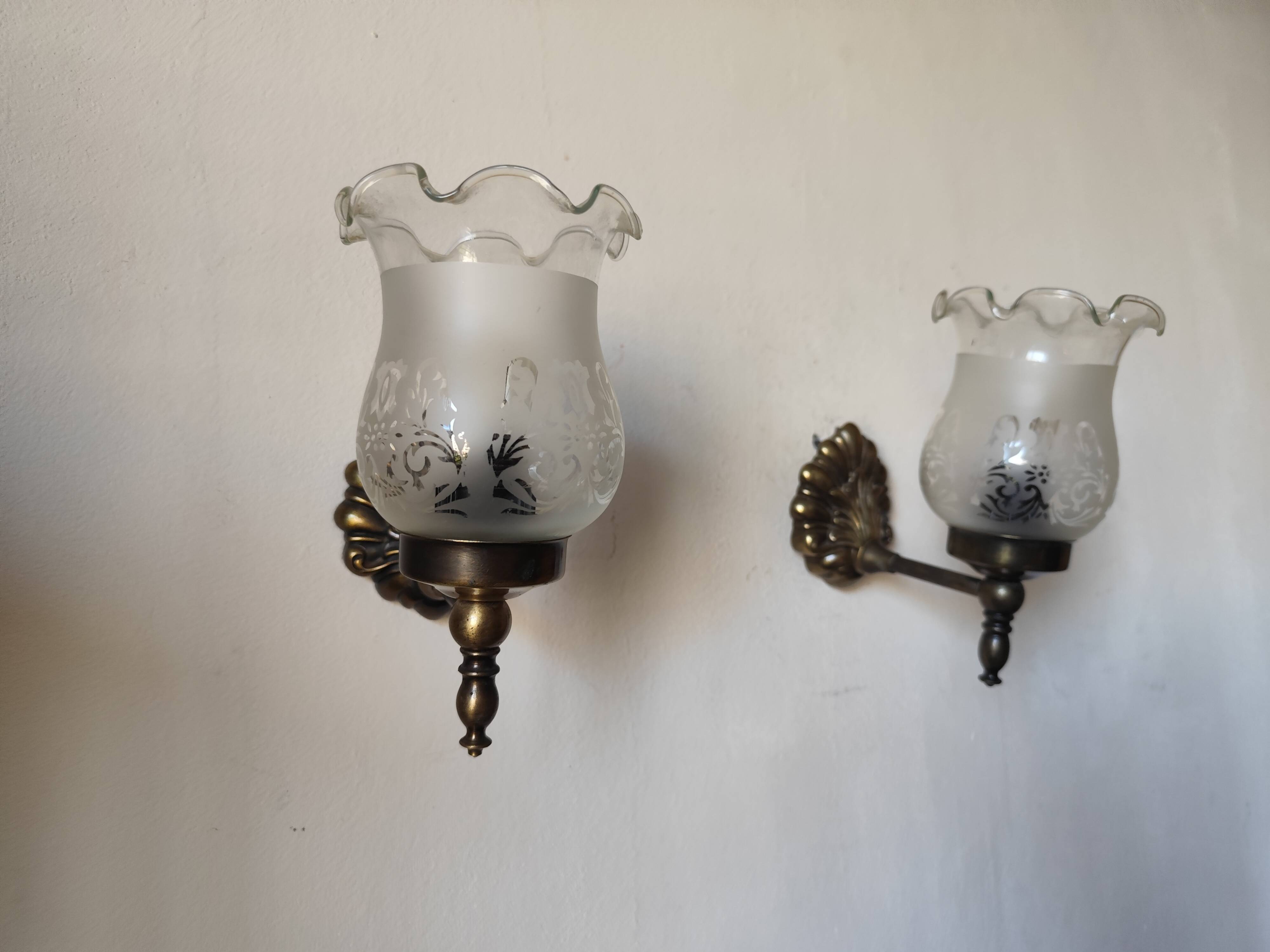 Pair of wall sconces in bronze with opaline glass tulips.