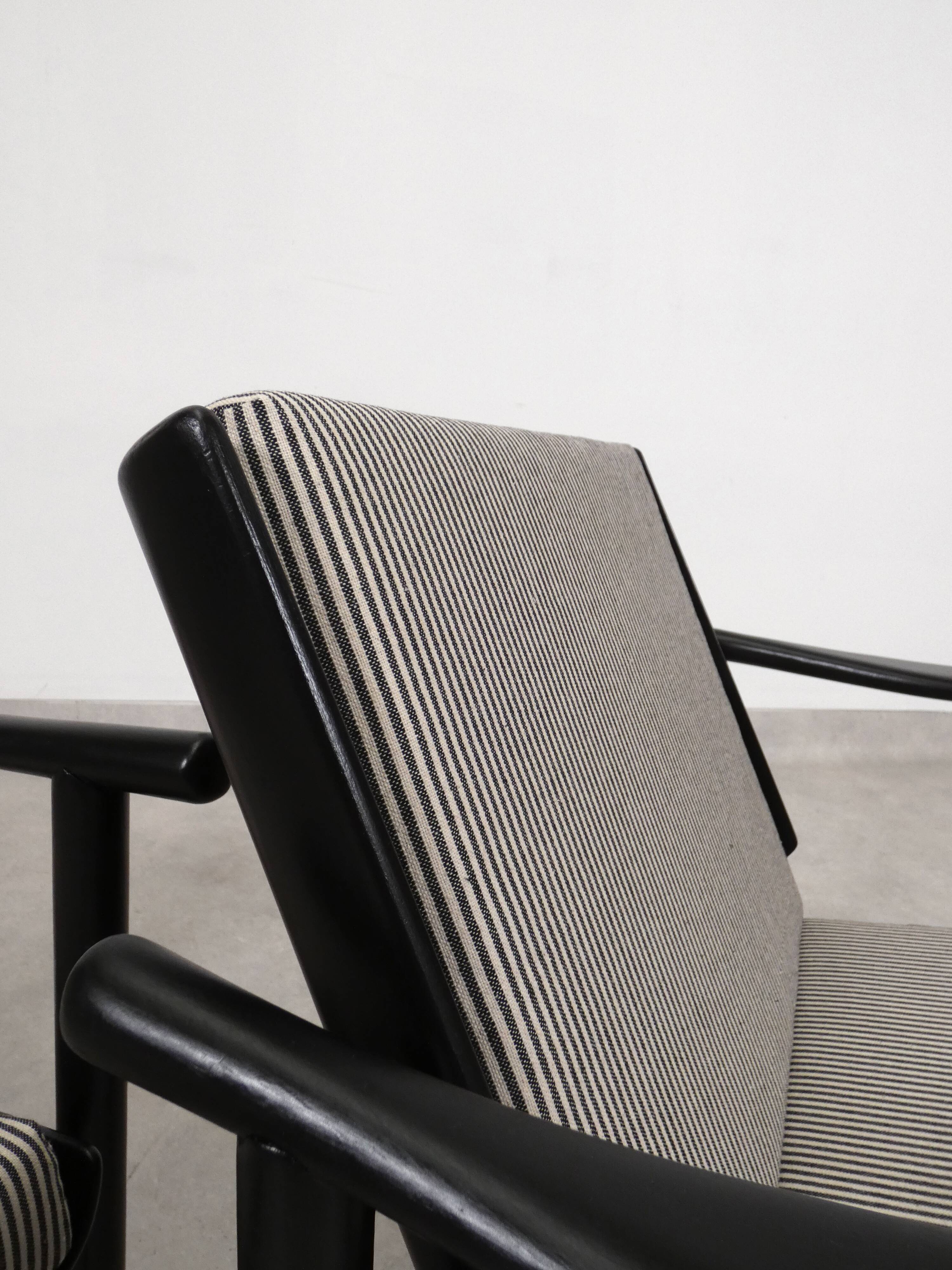 2x wooden Scandinavian arm chairs