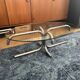 Oval glass coffee table with chrome legs, vintage 70s design.