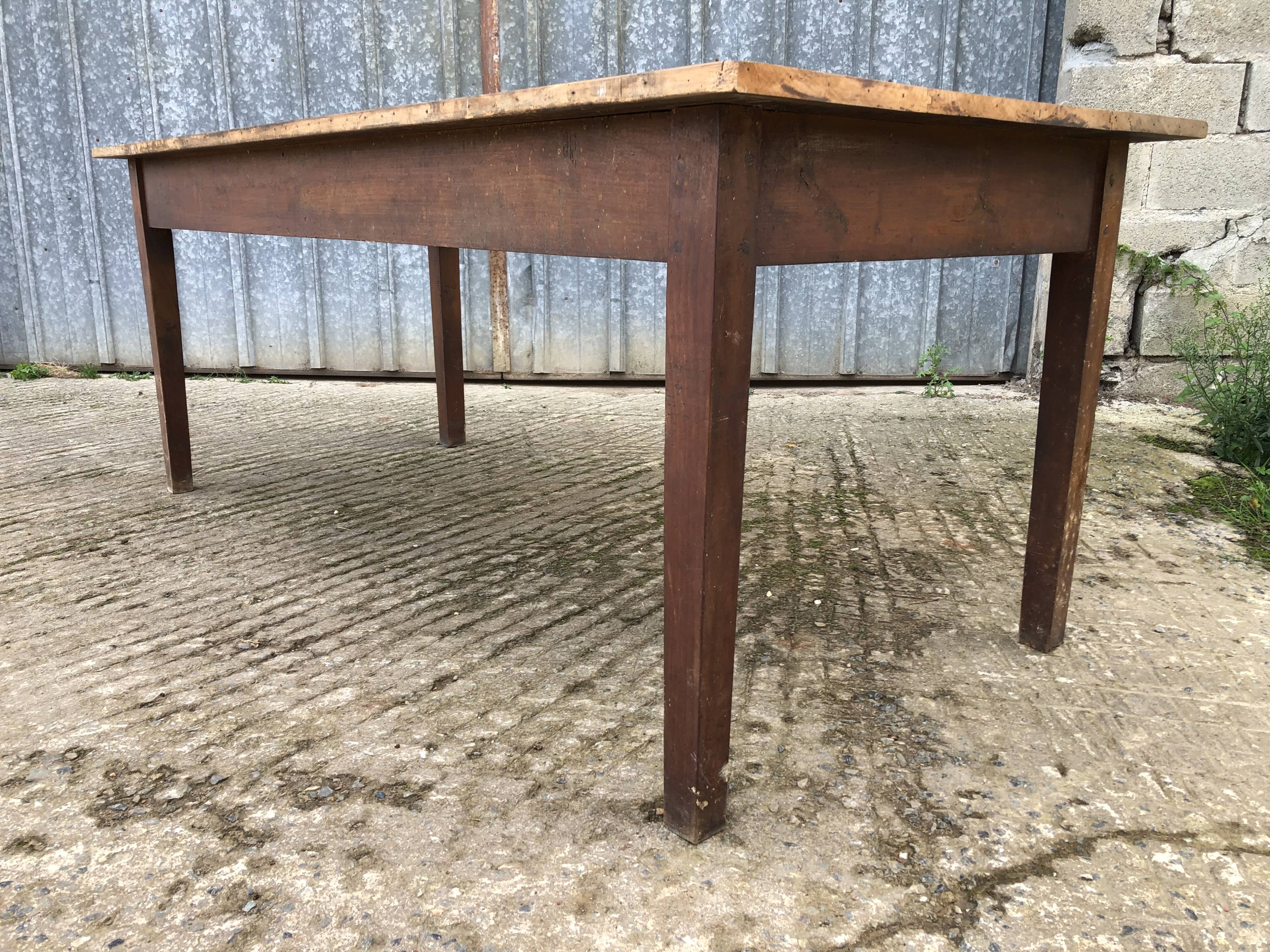 Rustic antique farmhouse table in solid cherry wood.