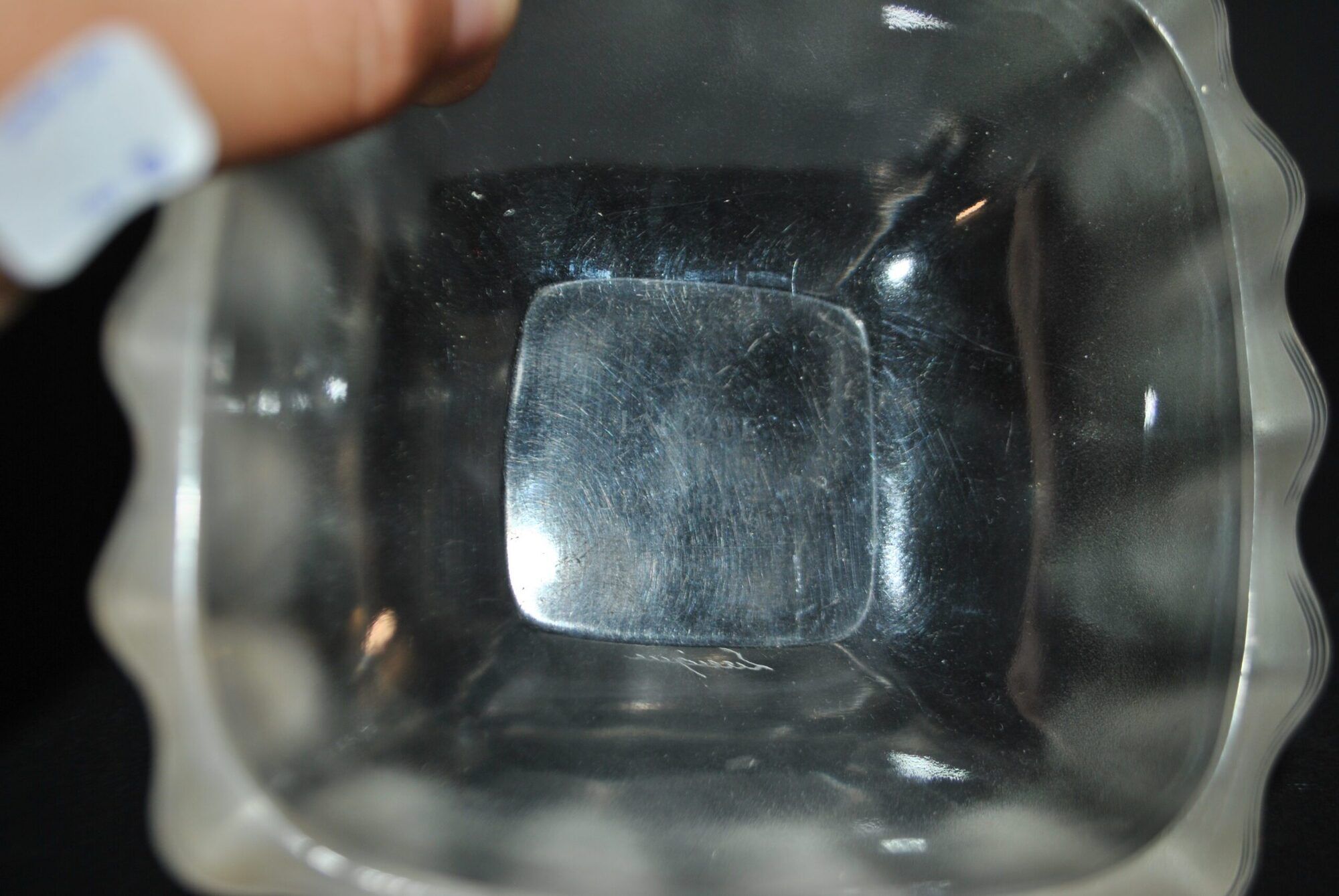 Lalique glass ashtray bowl with frosted finish, engraved with wave design, signed Lalique.