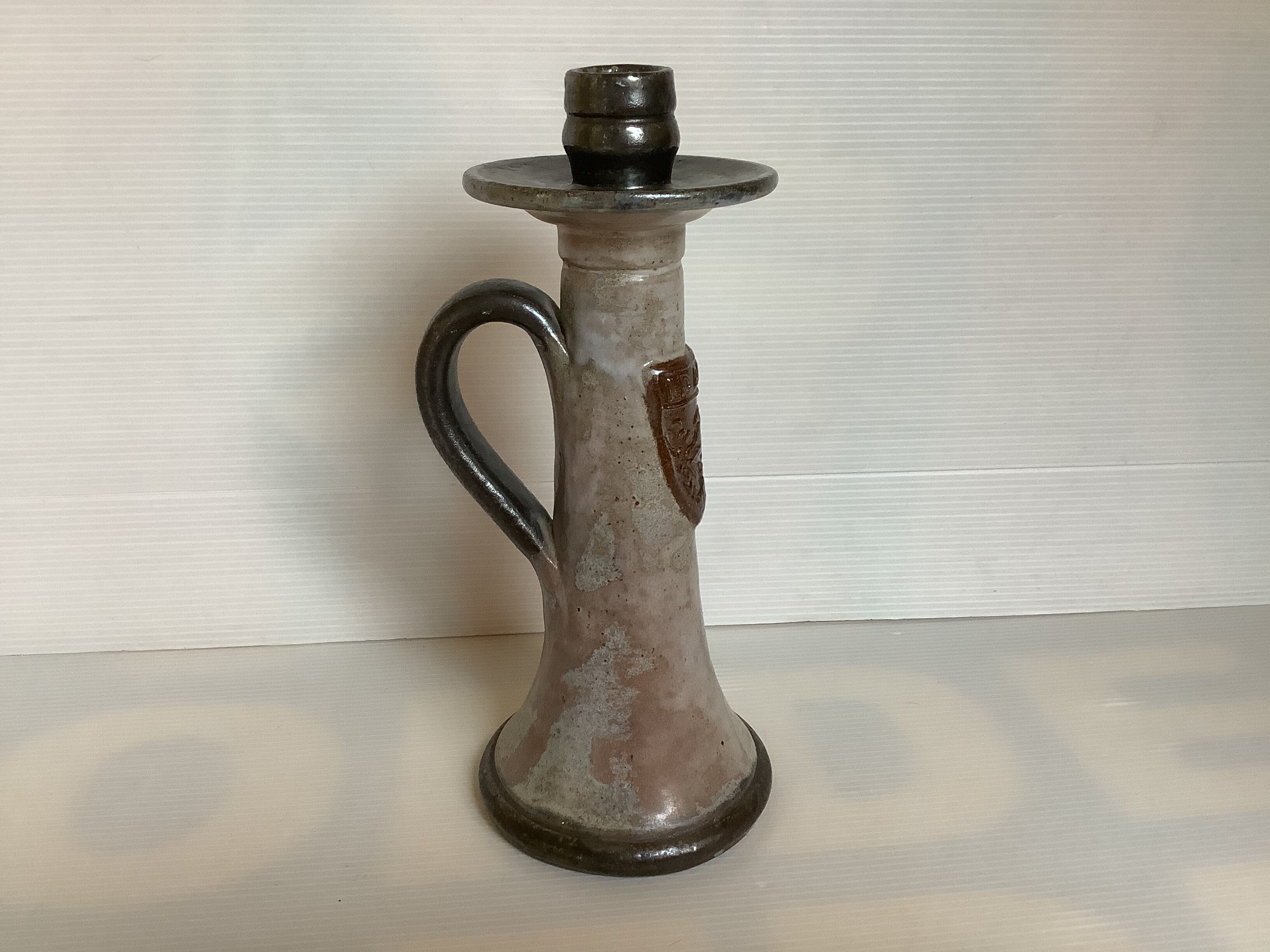 Bouffioulx style stoneware candle holder with a coat of arms