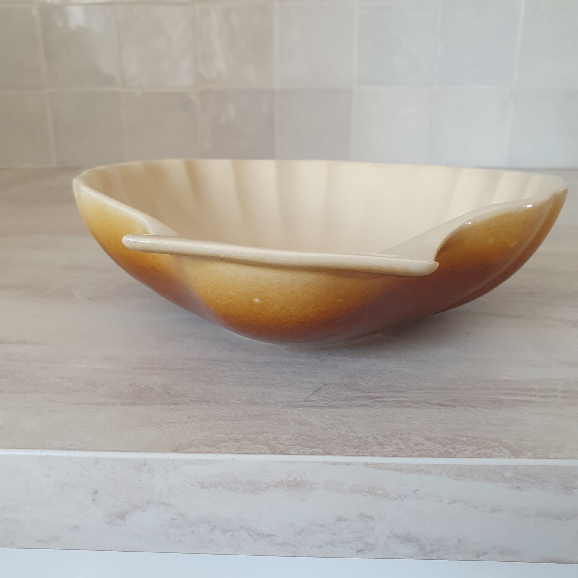Brown and white ceramic shell bowl