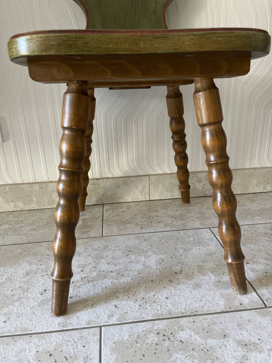 Wooden dressing table with olive green chair and floral patterns
