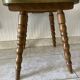 Wooden dressing table with olive green chair and floral patterns