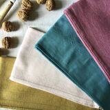 Set of four old damask towels tinted in multiple colors