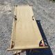 Ancien lit de camp militaire en bois et toile