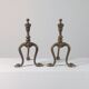 Paire de chenets en laiton au design zoomorphe vintage.