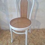 4 white rattan and cane chairs