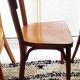 Set of 4 light wood bistro chairs stamped Baumann and Thonet.