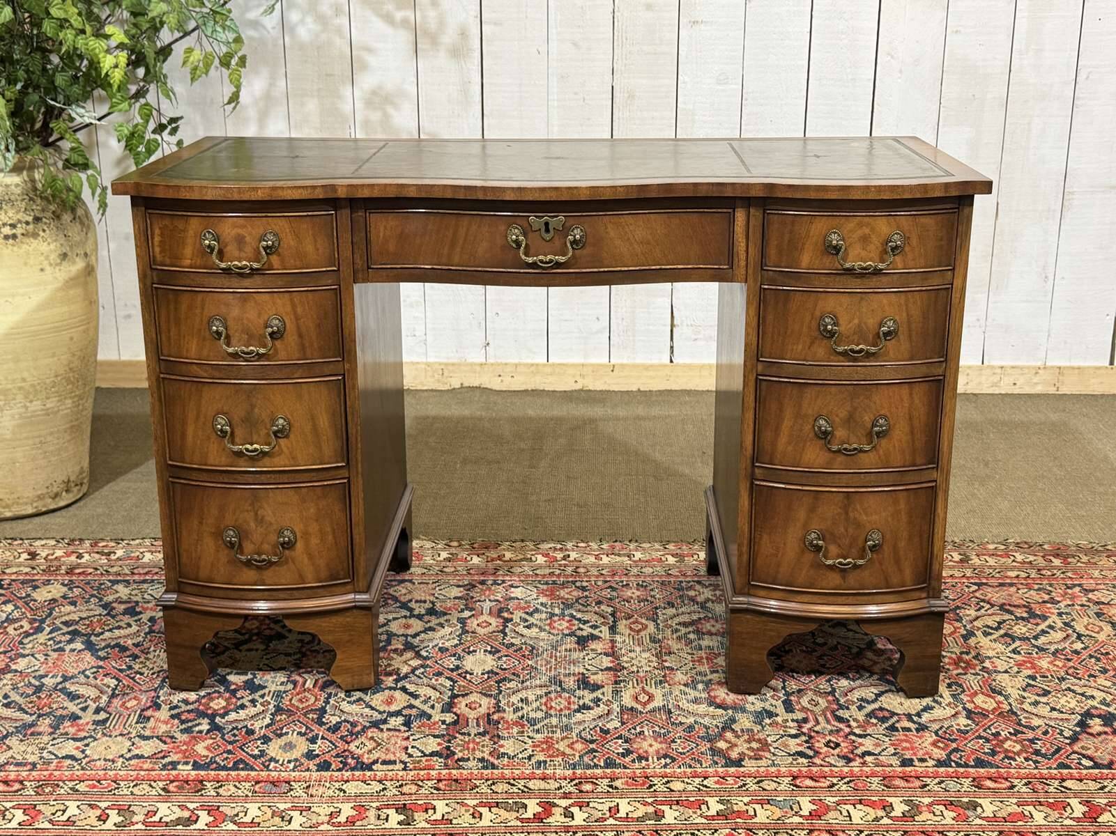 English desk from the 1950s in mahogany with a leather top.