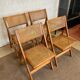 Quatre chaises pliantes cannées 1970