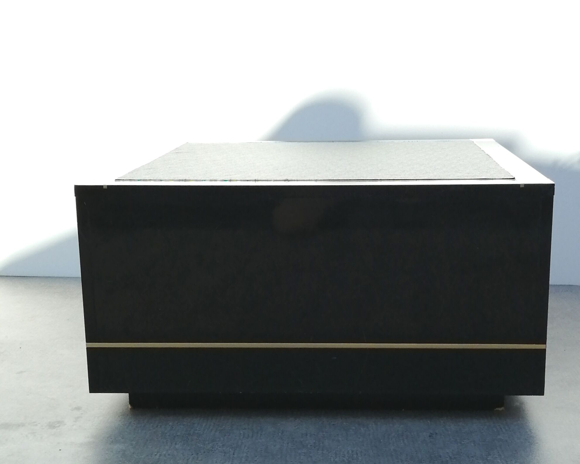 Designer coffee table in black lacquered wood and vintage brass