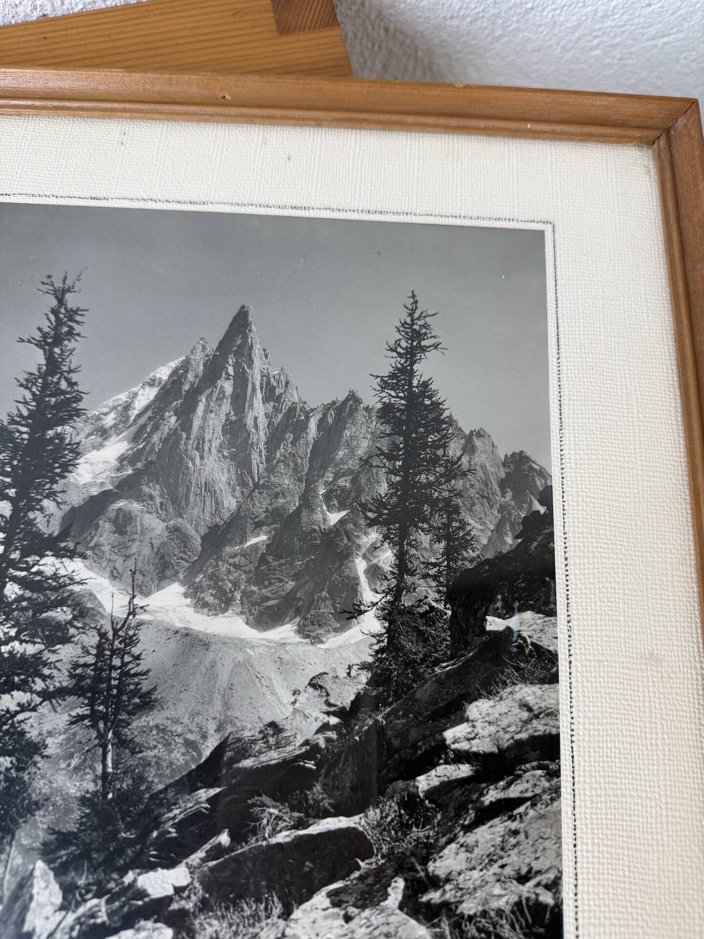 Framed old photo of a mountain landscape.