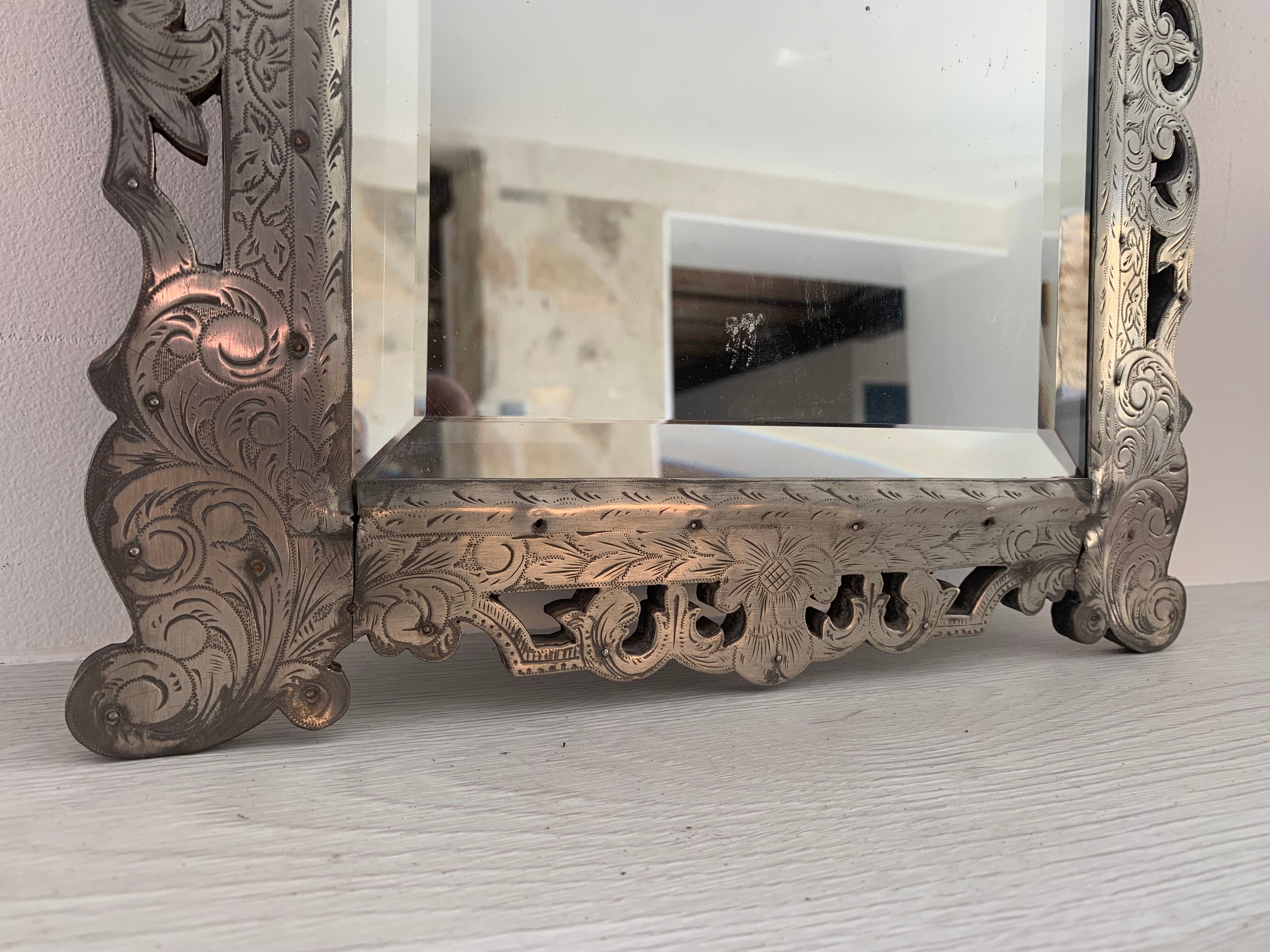 Eventful beveled mirror and openwork period 1900 repelled tin decoration