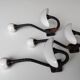 Trois patères doubles en fer forgé et porcelaine