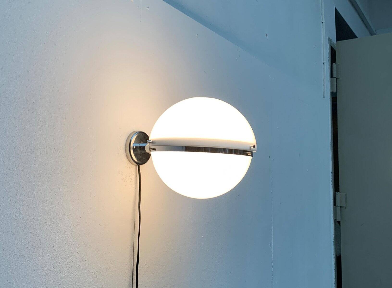 Mid-century Italian space age spherical wall light by Guzzini.