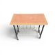 Vintage 1950s magazine table in metal and formica.
