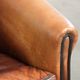 Vintage sheepskin club armchair finished with black piping