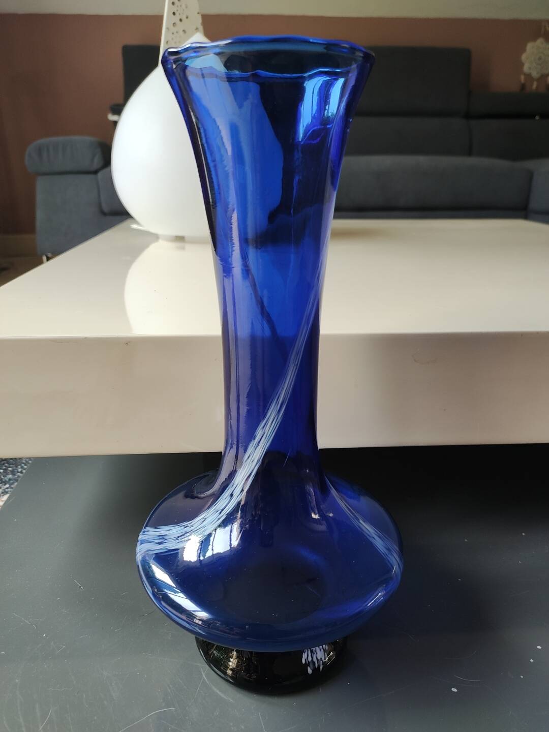 Long flared neck ball vase. Smoked scrolls in cobalt blue art glass, 30cm