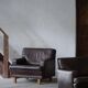 Pair of modern Danish lounge chairs in dark brown leather and rosewood, 1960s.