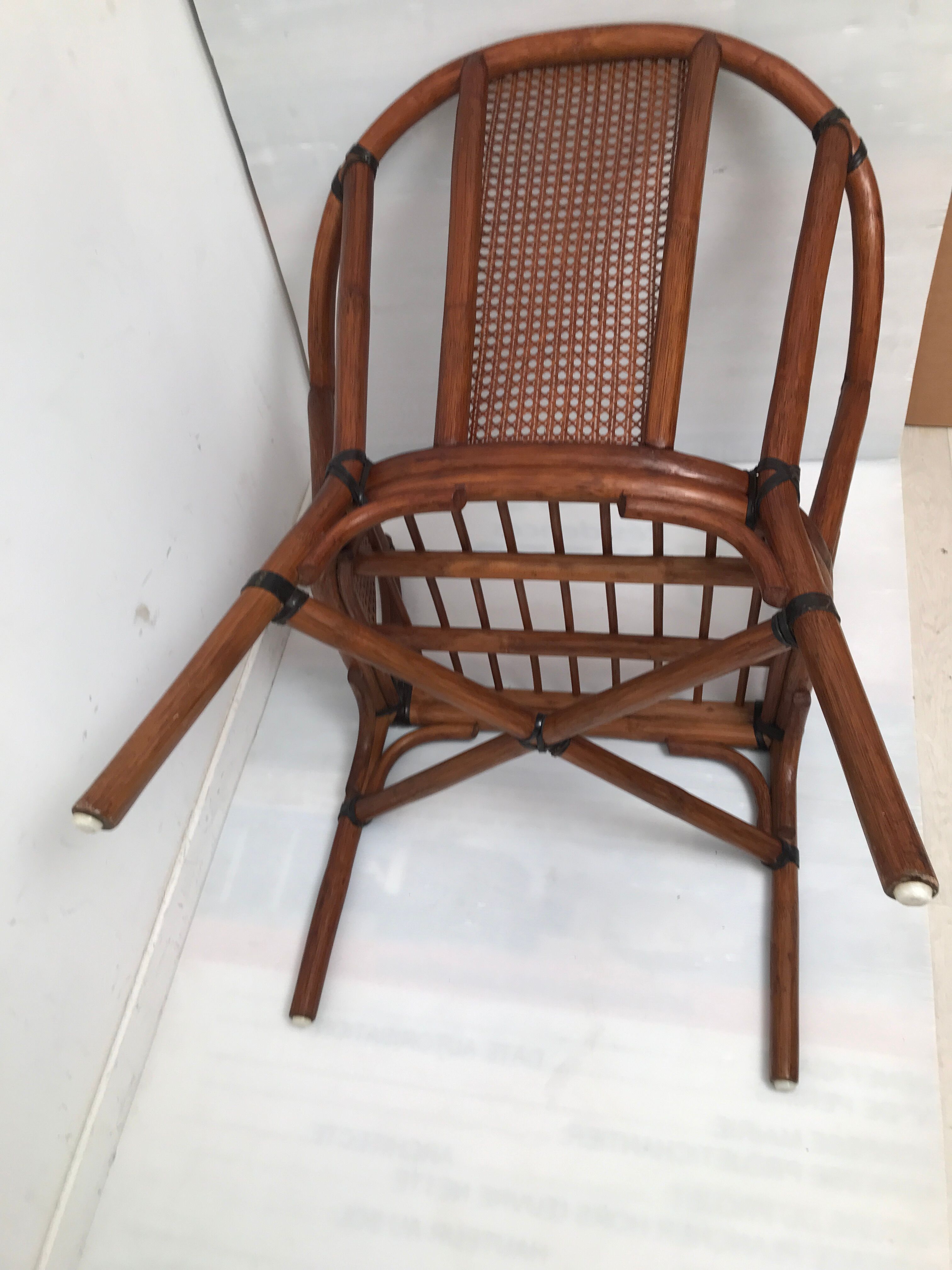 Rattan armchair with its footrest 70s