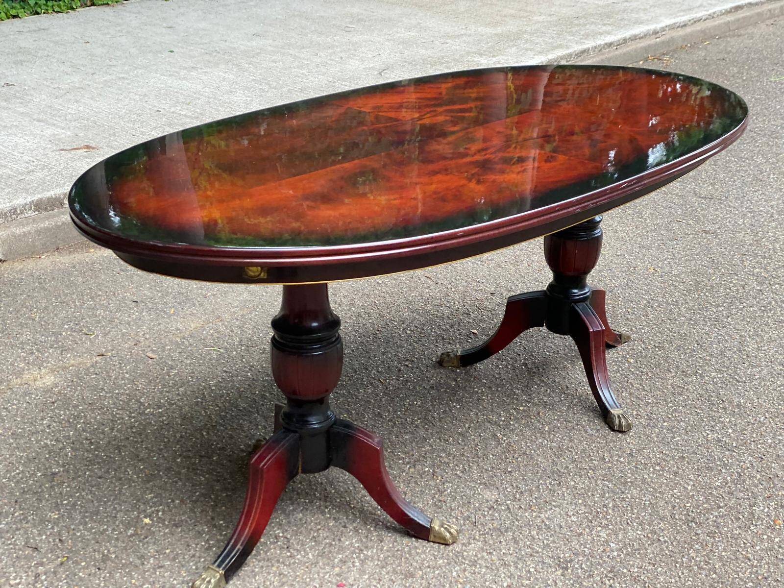 Glossy mahogany dining table in English Regency style from the 1970s.