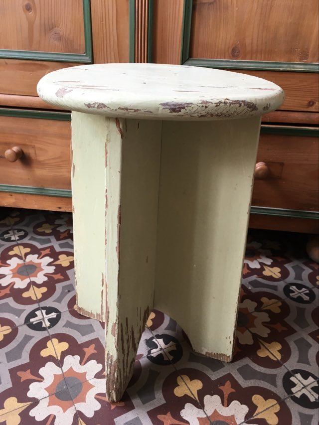 A rough wooden stool patinated by time