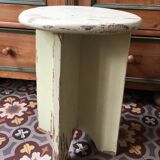 A rough wooden stool patinated by time